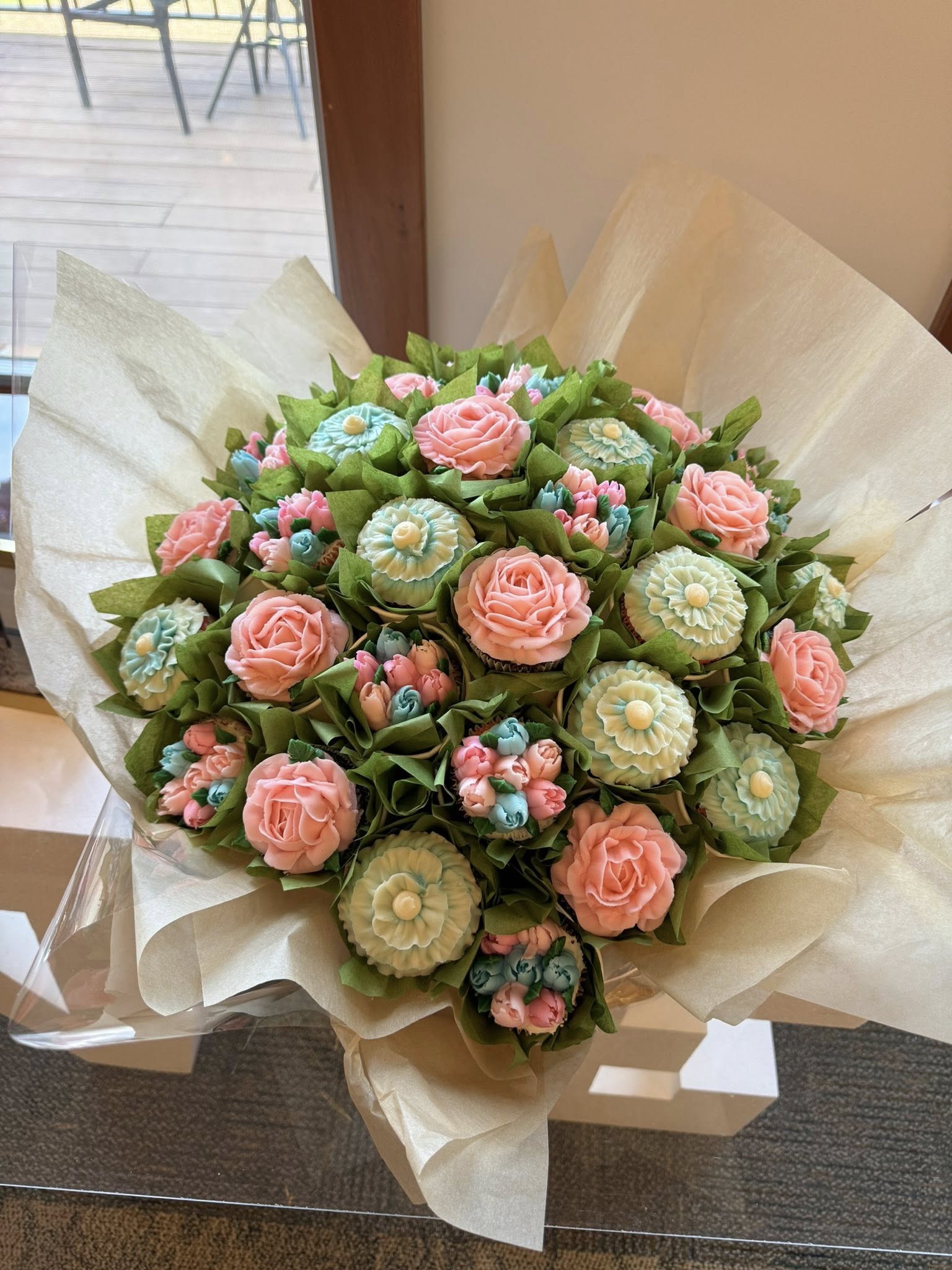 Cupcake bouquet decorated like pastel flowers